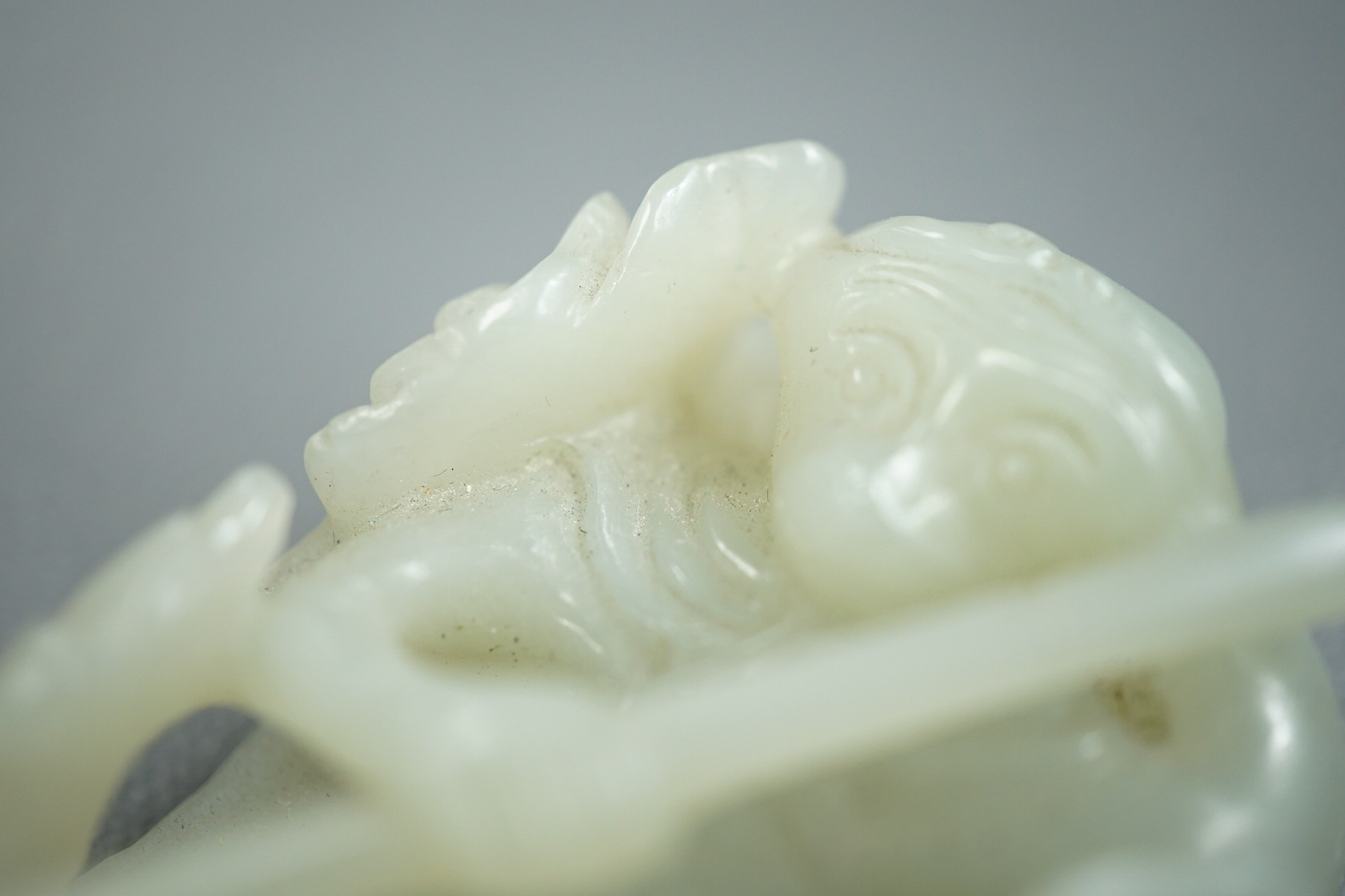 A Chinese pale celadon jade carving of Sun Wukong, the Monkey King, 18th/19th century